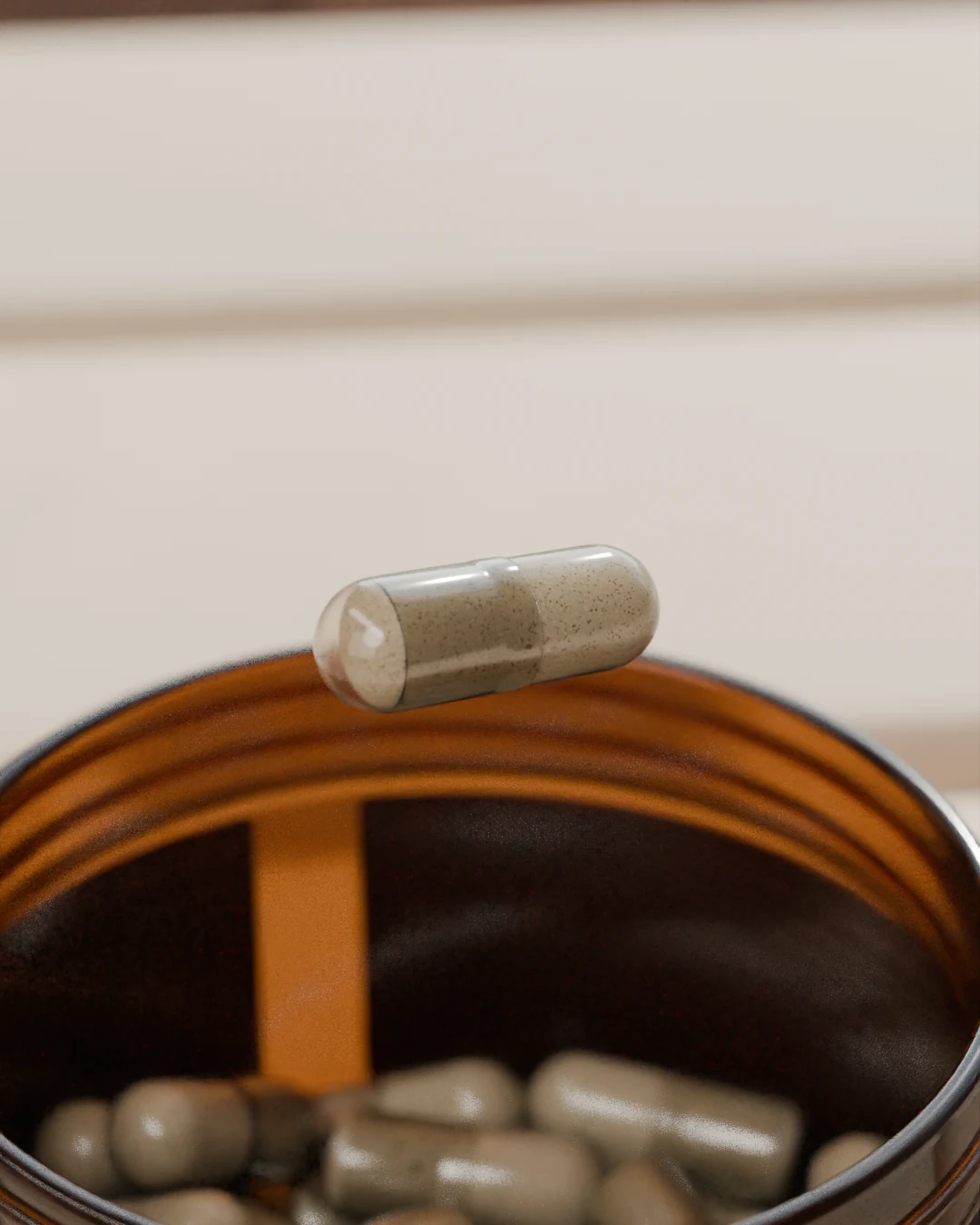 The capsule settling back into the open jar